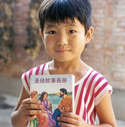 Chinese Girl holding Christian New Testament